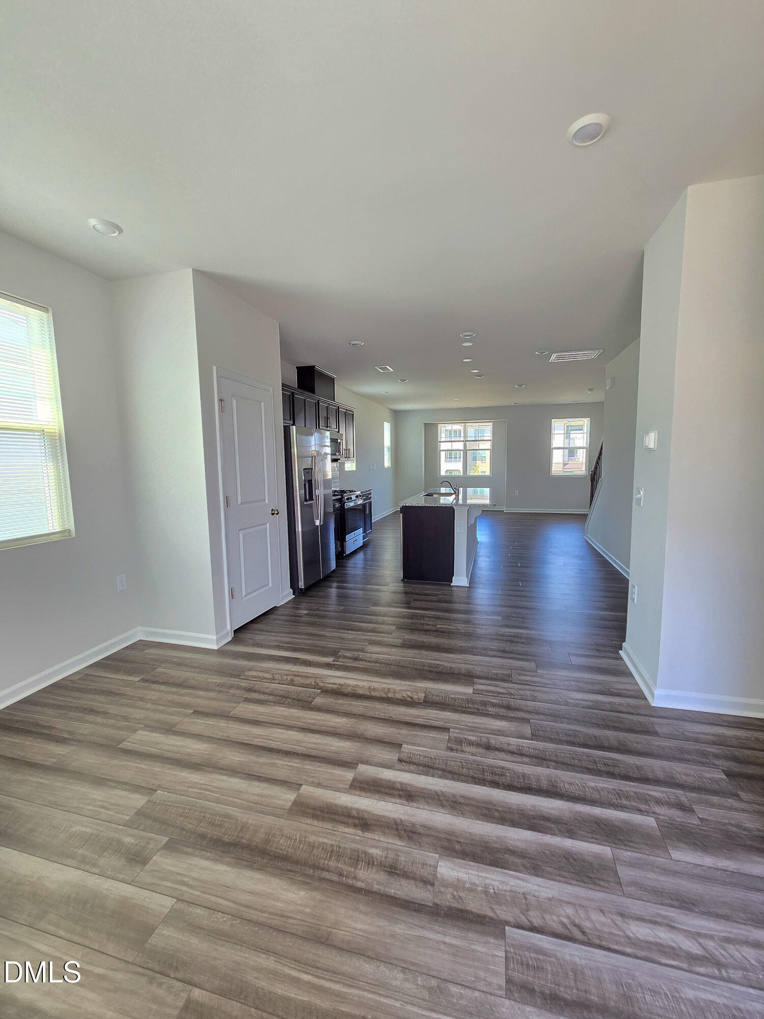 2431 Kasota Lane Raleigh, NC 27610 - Photo 12 of 46 a view of livingroom with hardwood floor and a ceiling fan
