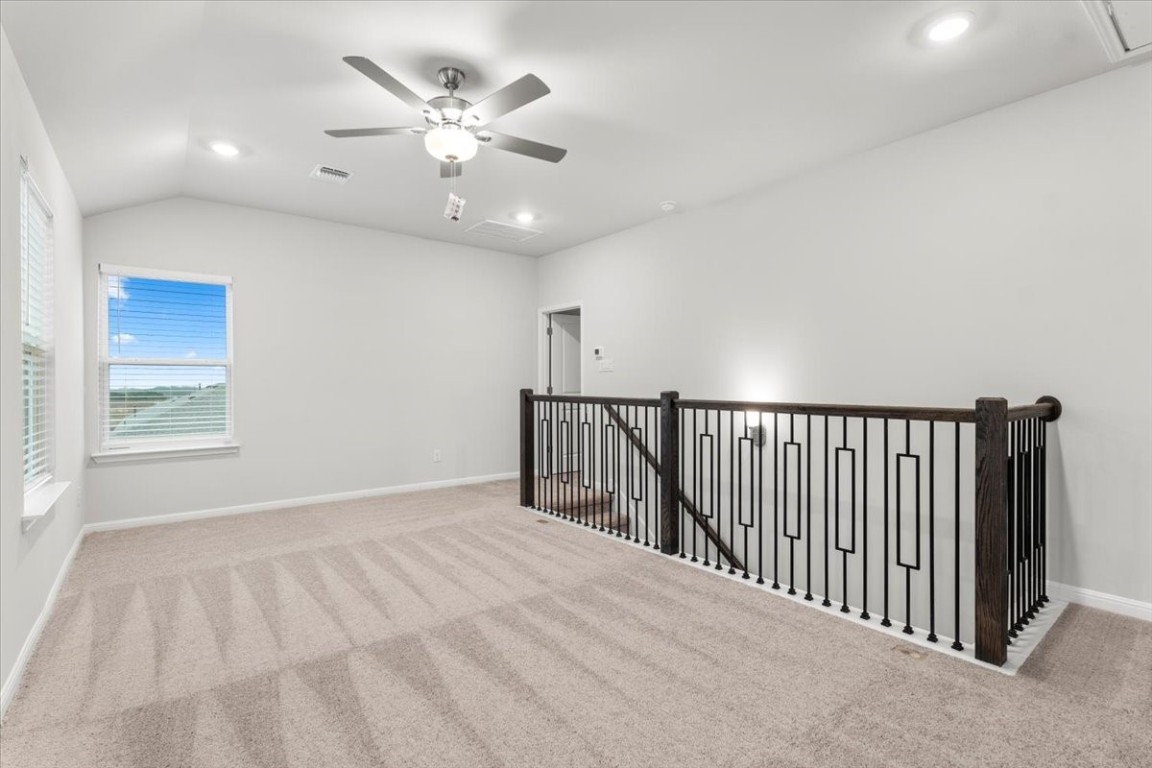 320 Windstar Road Liberty Hill, TX 78642 - Photo 18 of 29 a view of a livingroom with a ceiling fan and window