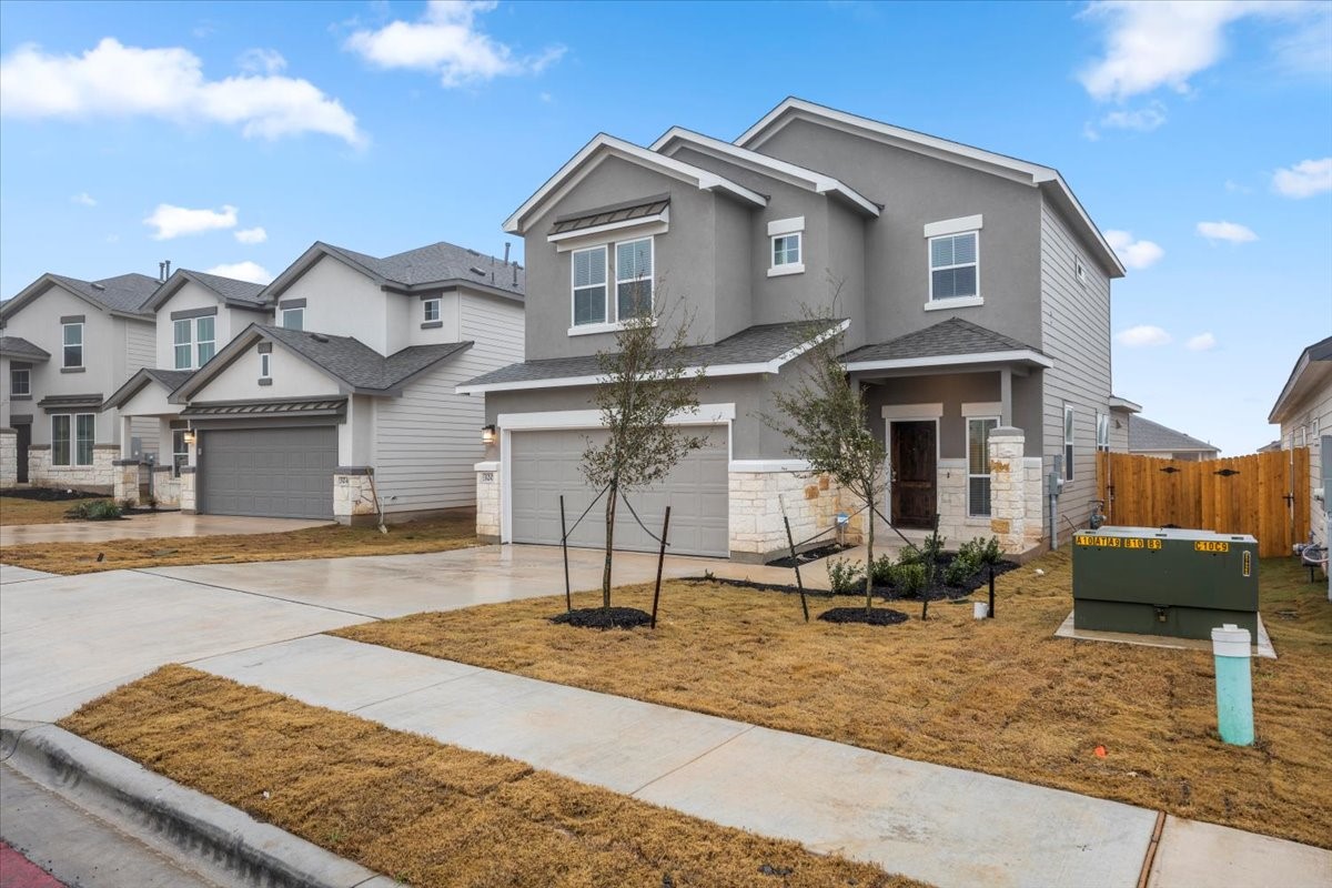 320 Windstar Road Liberty Hill, TX 78642 - Photo 2 of 29 a front view of a house with garden