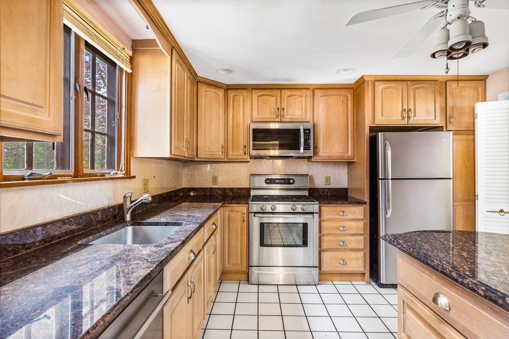 10 Old Coach Road Canton, MA 02021 - Photo 3 of 42 a kitchen with stainless steel appliances granite countertop a stove a sink and a refrigerator