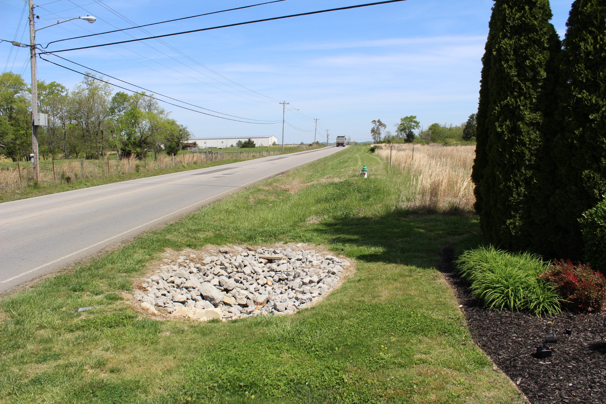 0 Port Royal Road Spring Hill, TN 37174 - Photo 3 of 7 a view of a back yard of the house and front view of a house