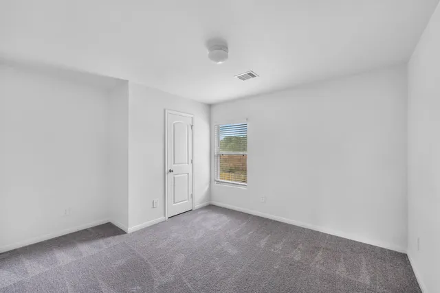 a view of empty room with windows