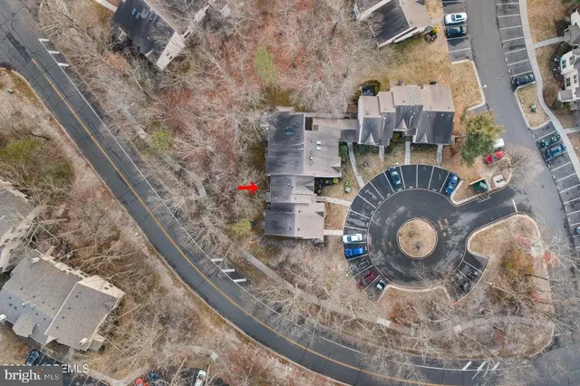an aerial view of a house with a backyard