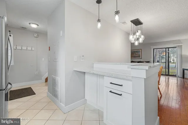 a bathroom with a sink a mirror and a shower