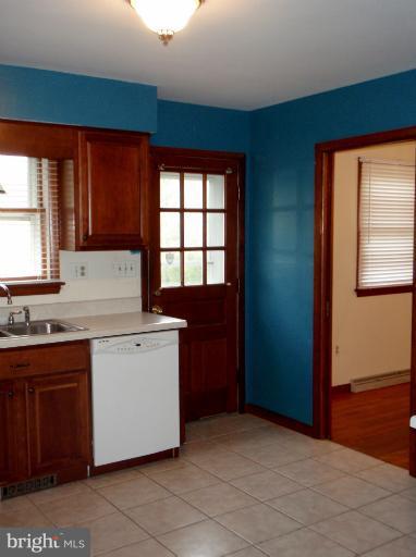 43594 Hay Road Ashburn, VA 20147 - Photo 12 of 16 a kitchen with a sink stove and cabinets
