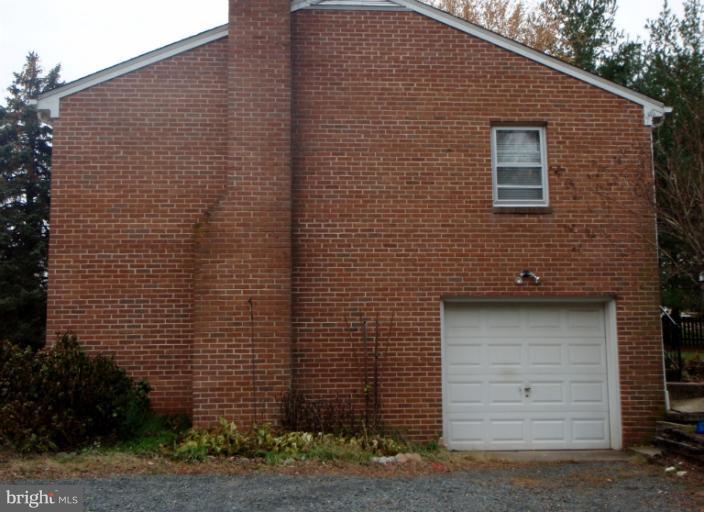 43594 Hay Road Ashburn, VA 20147 - Photo 4 of 16 a front view of a house with garage