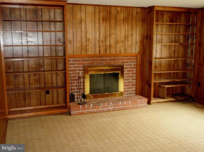 43594 Hay Road Ashburn, VA 20147 - Photo 8 of 16 a view of an empty room with a fireplace