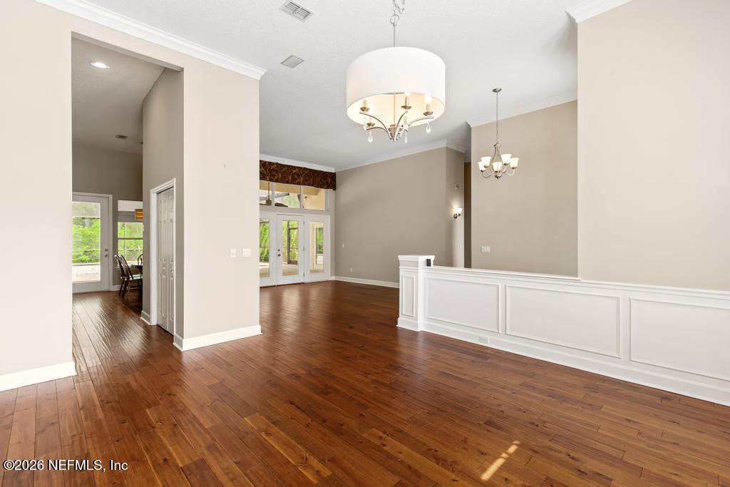 337 South Mill View Way Ponte Vedra Beach, FL 32082 - Photo 13 of 63 a view of an empty room with wooden floor and a window