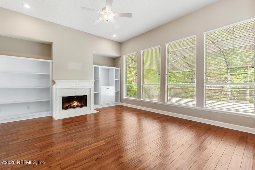 337 South Mill View Way Ponte Vedra Beach, FL 32082 - Photo 22 of 63 a view of an empty room with wooden floor and a window