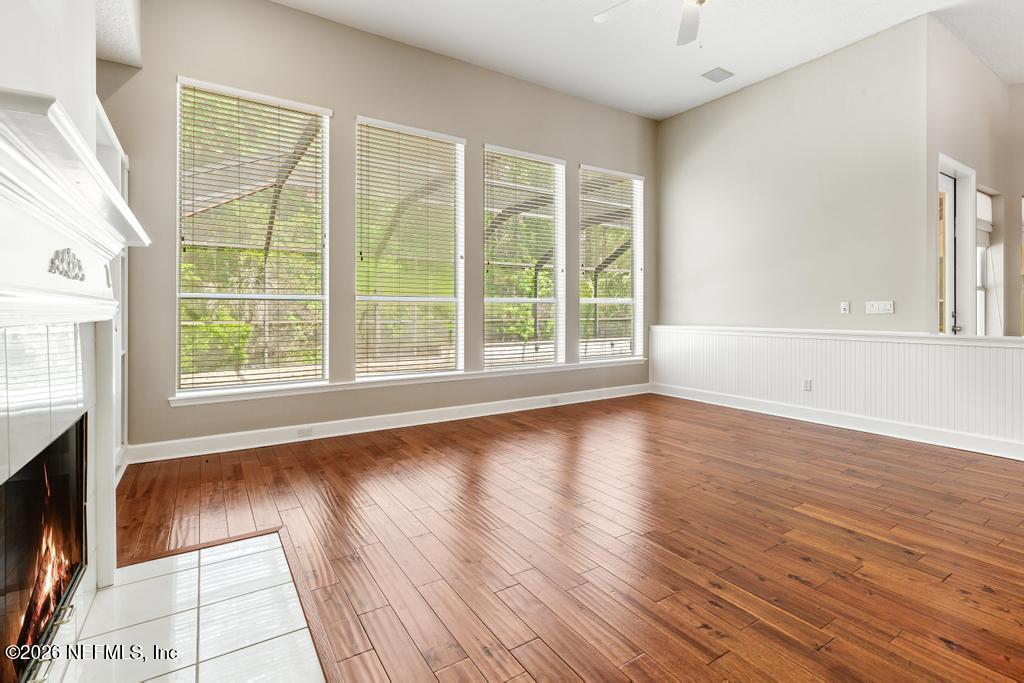 337 South Mill View Way Ponte Vedra Beach, FL 32082 - Photo 23 of 63 a view of an empty room with wooden floor and a window