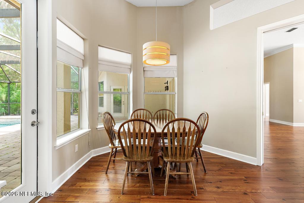 337 South Mill View Way Ponte Vedra Beach, FL 32082 - Photo 26 of 63 a view of a dining room with furniture window and wooden floor