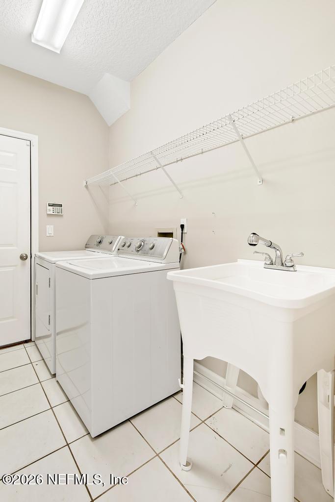 337 South Mill View Way Ponte Vedra Beach, FL 32082 - Photo 47 of 63 a utility room with dryer and washer