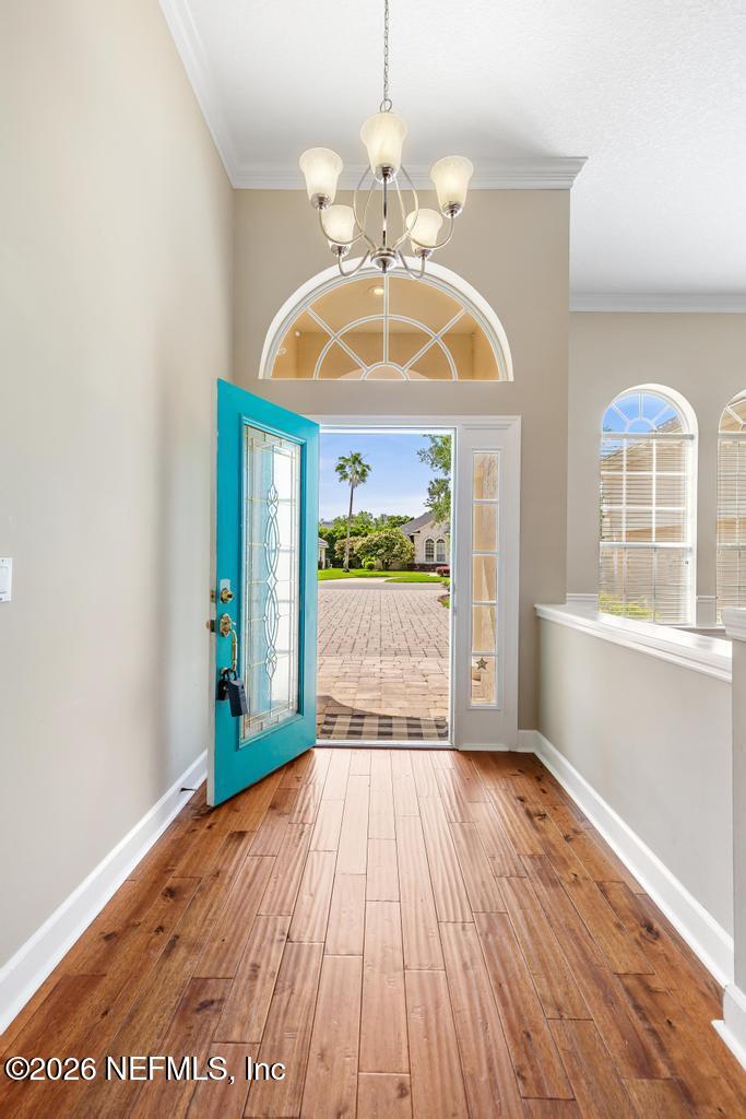 337 South Mill View Way Ponte Vedra Beach, FL 32082 - Photo 5 of 63 a view of an empty room with wooden floor and a window