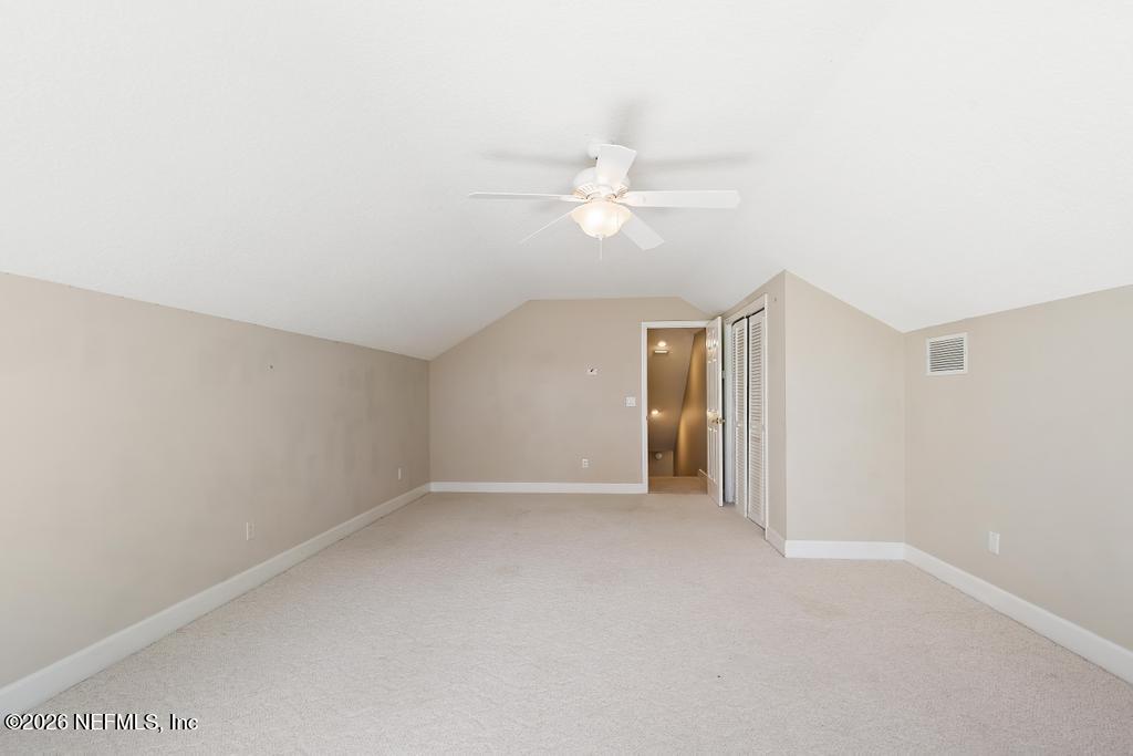 337 South Mill View Way Ponte Vedra Beach, FL 32082 - Photo 51 of 63 an empty room with a ceiling fan and a window