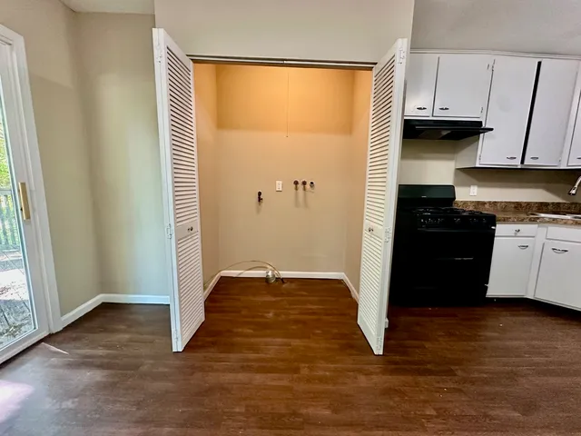 a view of a kitchen with a sink and a window