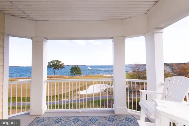 a view of a porch with a floor to ceiling window