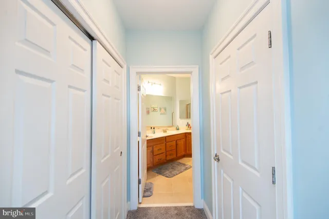 a view of a bathroom from a hallway
