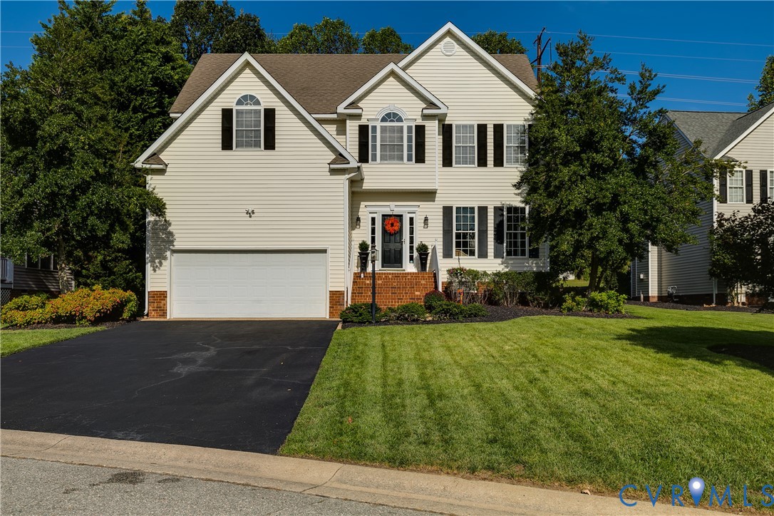 806 Biggin Pond Road Midlothian, VA 23114 - Photo 2 of 50 a front view of a house with a yard