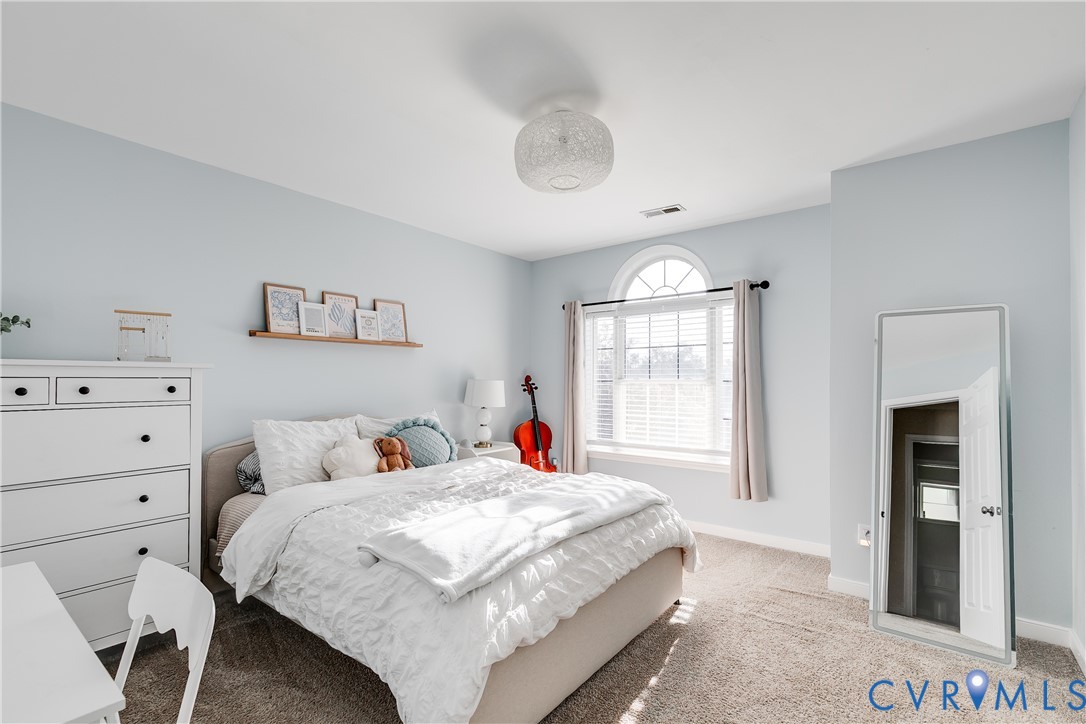 806 Biggin Pond Road Midlothian, VA 23114 - Photo 31 of 50 a bed room with a bed and a window