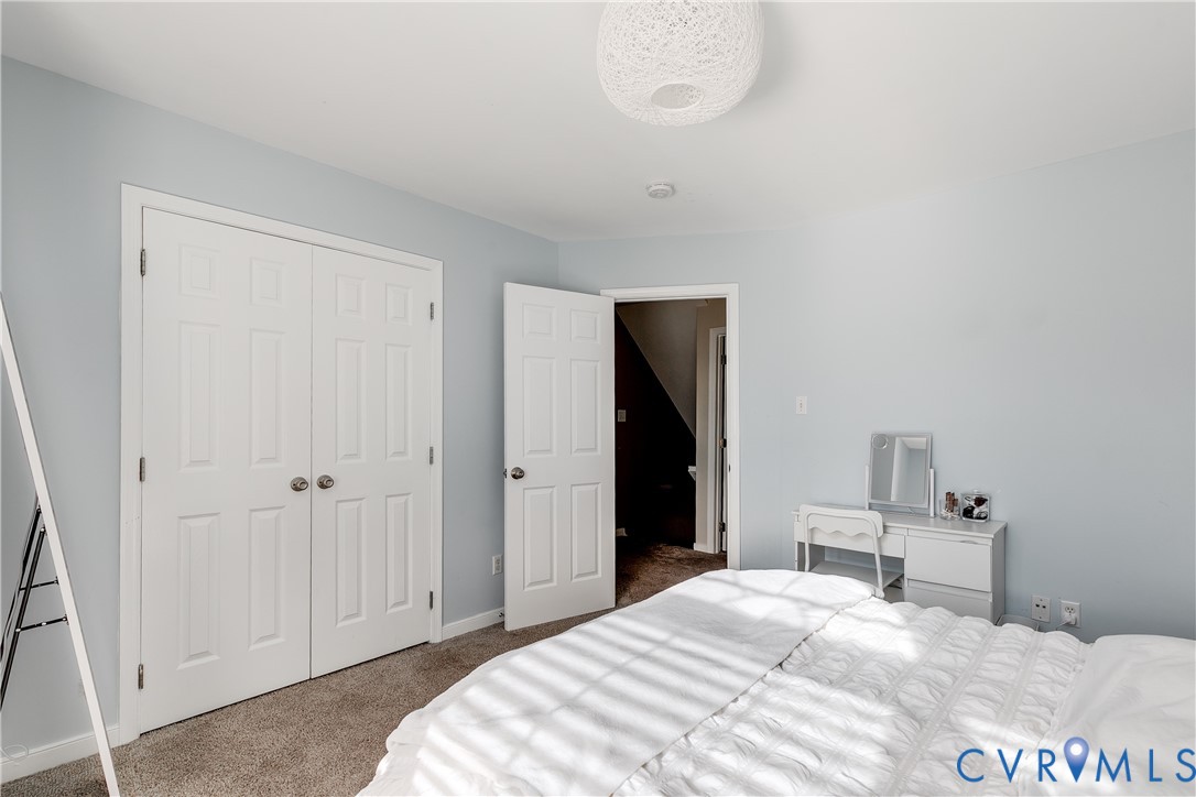 806 Biggin Pond Road Midlothian, VA 23114 - Photo 32 of 50 a bedroom with a bed and a table in it