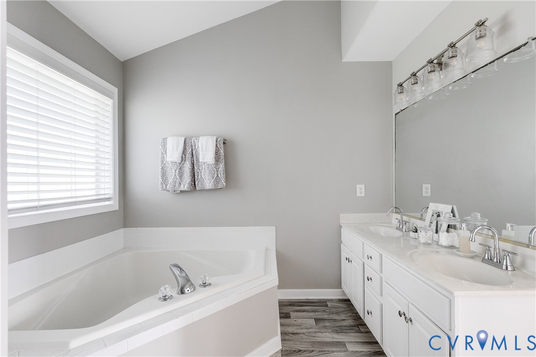 806 Biggin Pond Road Midlothian, VA 23114 - Photo 39 of 50 a bathroom with a tub sink and mirror