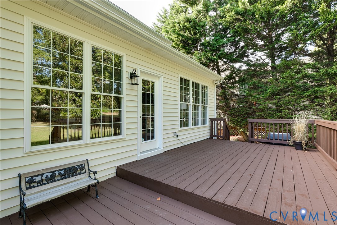 806 Biggin Pond Road Midlothian, VA 23114 - Photo 47 of 50 a view of a wooden deck with a bench