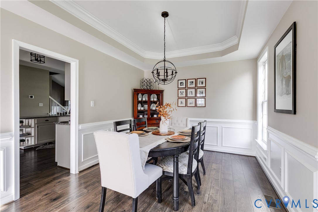 806 Biggin Pond Road Midlothian, VA 23114 - Photo 9 of 50 a view of a dining room with furniture window and wooden floor