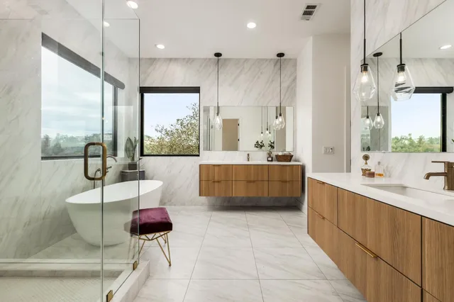 a bathroom with a toilet mirror and vanity