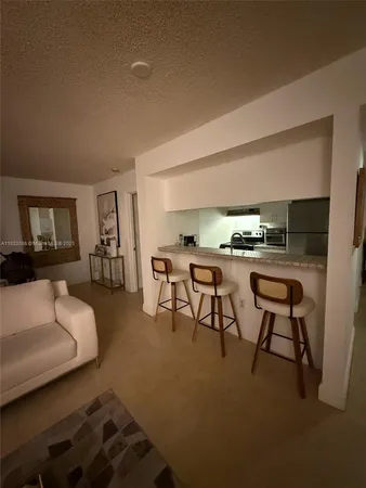 a stove top oven sitting inside of a kitchen