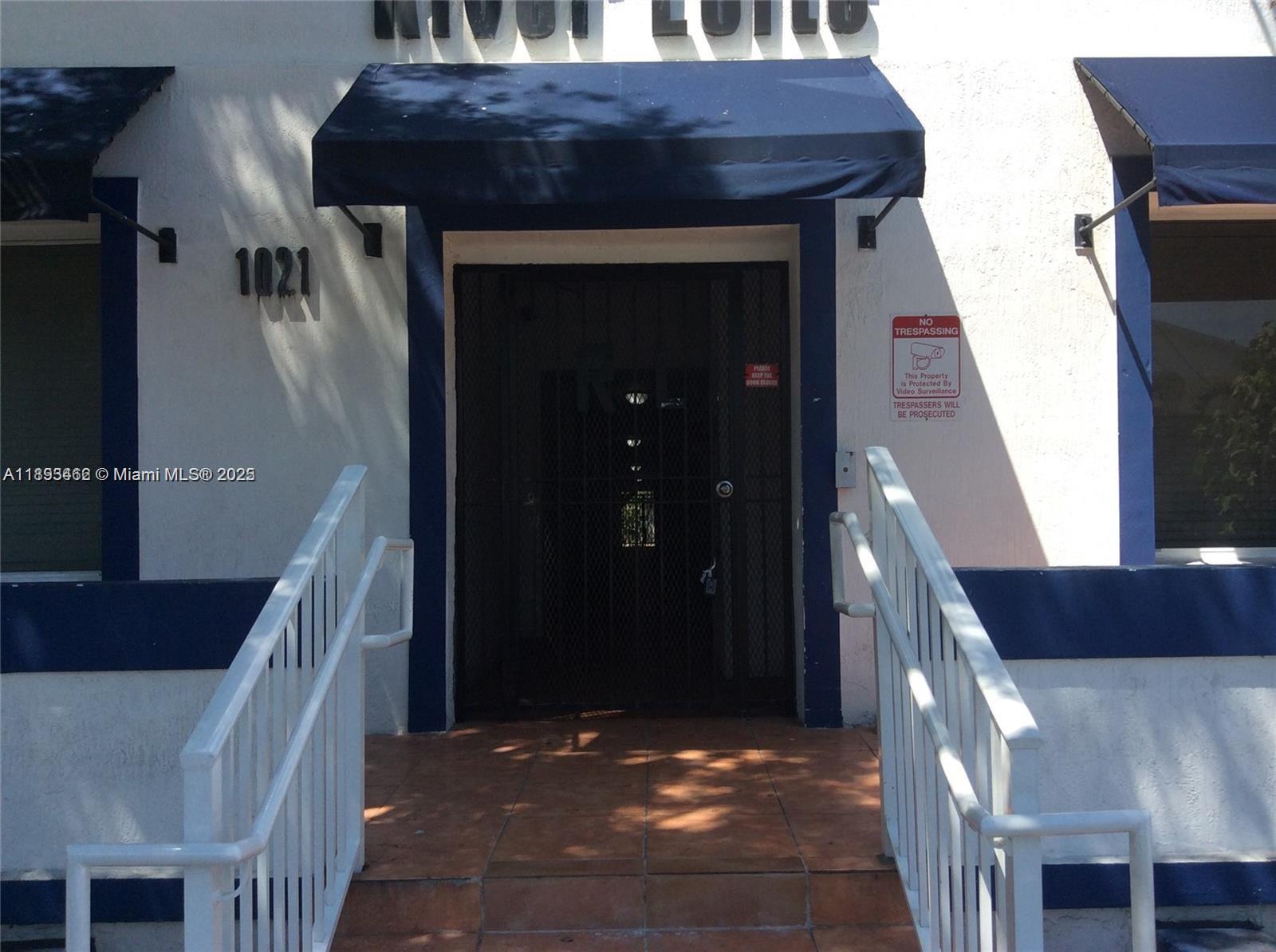 1021 Northwest 3rd Street, Unit 305 Miami, FL 33128 - Photo 11 of 22 a view of entryway and hall with wooden floor