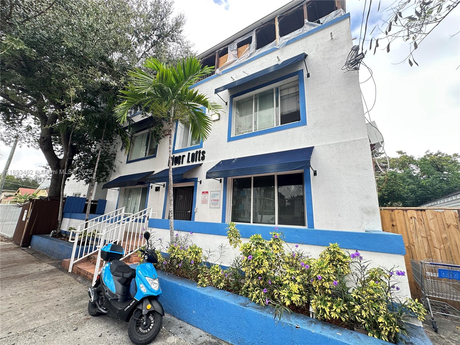 1021 Northwest 3rd Street, Unit 305 Miami, FL 33128 - Photo 13 of 22 front view of a house with a yard