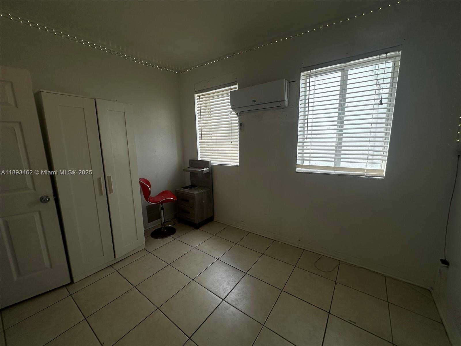 1021 Northwest 3rd Street, Unit 305 Miami, FL 33128 - Photo 17 of 22 a view of an empty room with a window