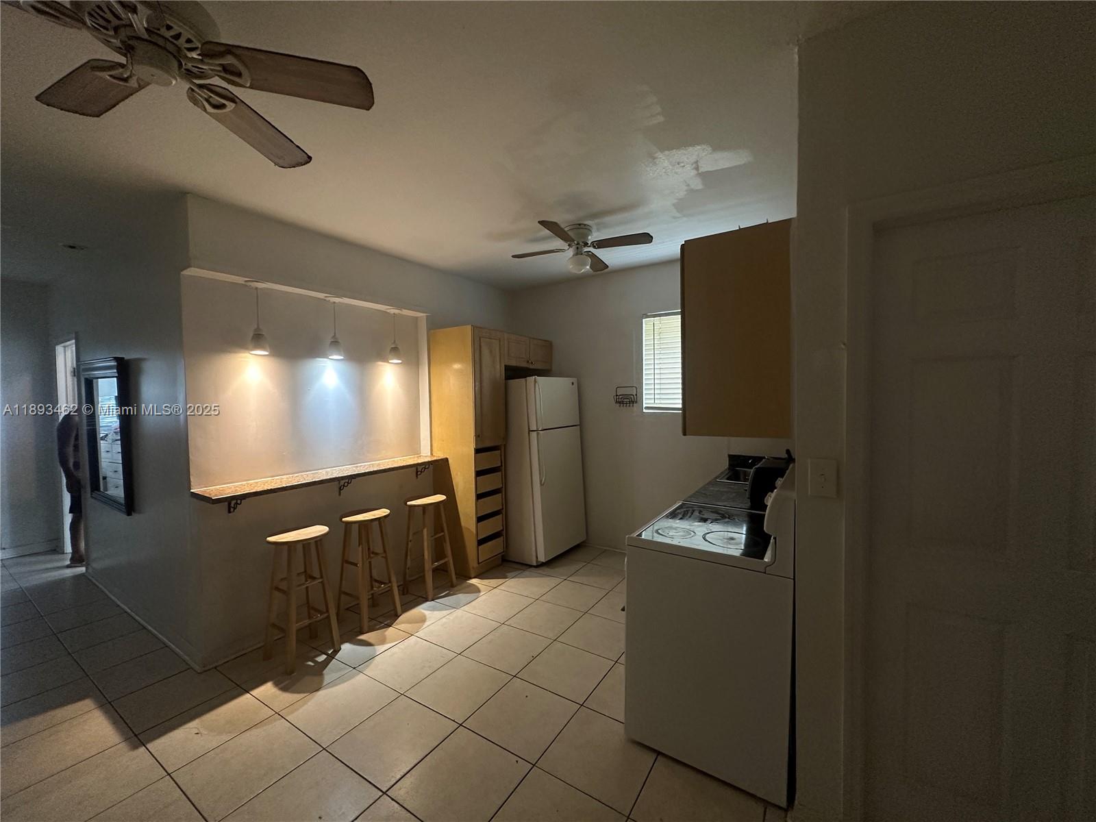 1021 Northwest 3rd Street, Unit 305 Miami, FL 33128 - Photo 19 of 22 a view of a room with gym equipment