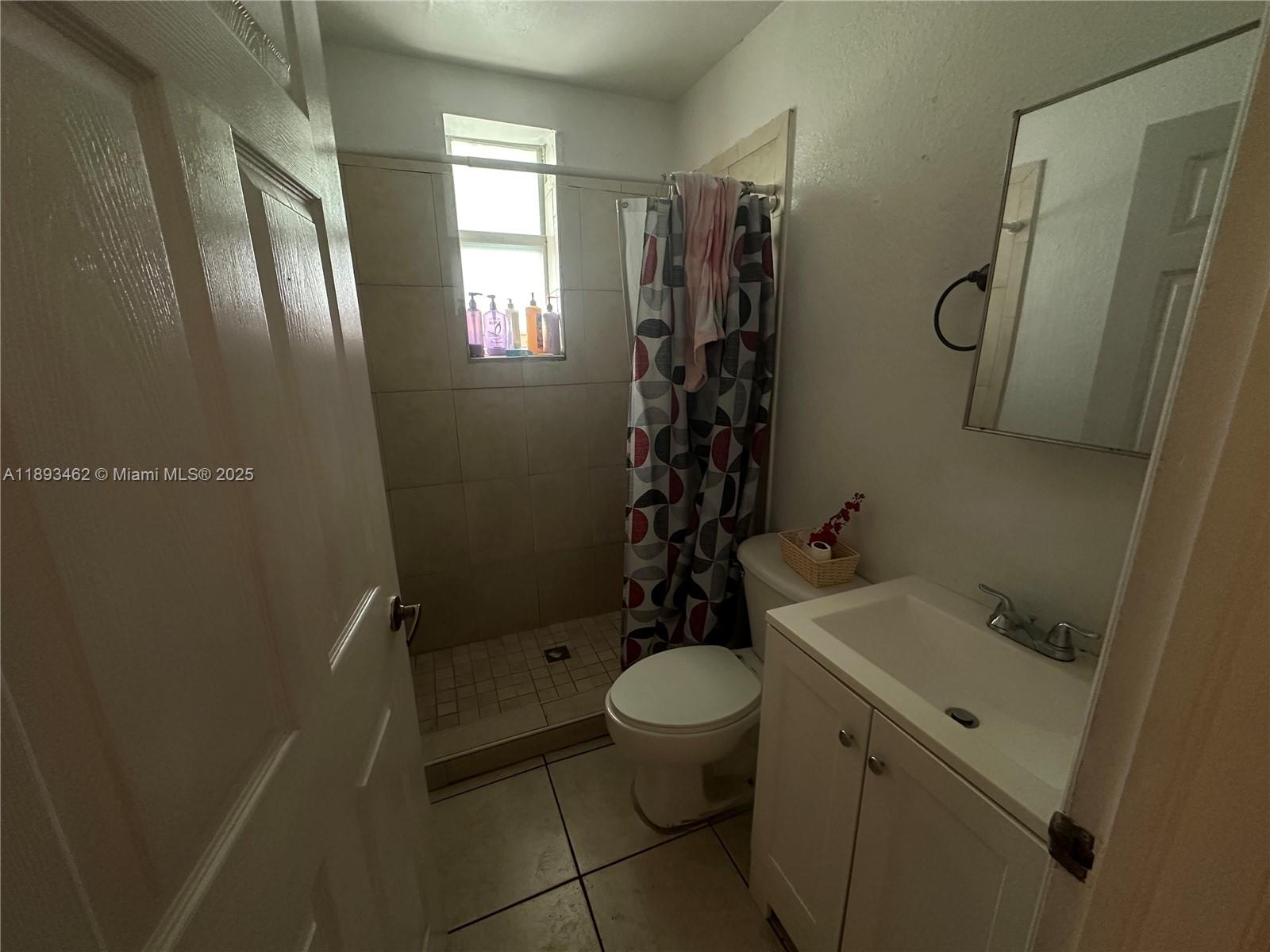 1021 Northwest 3rd Street, Unit 305 Miami, FL 33128 - Photo 22 of 22 a bathroom with a sink toilet and shower