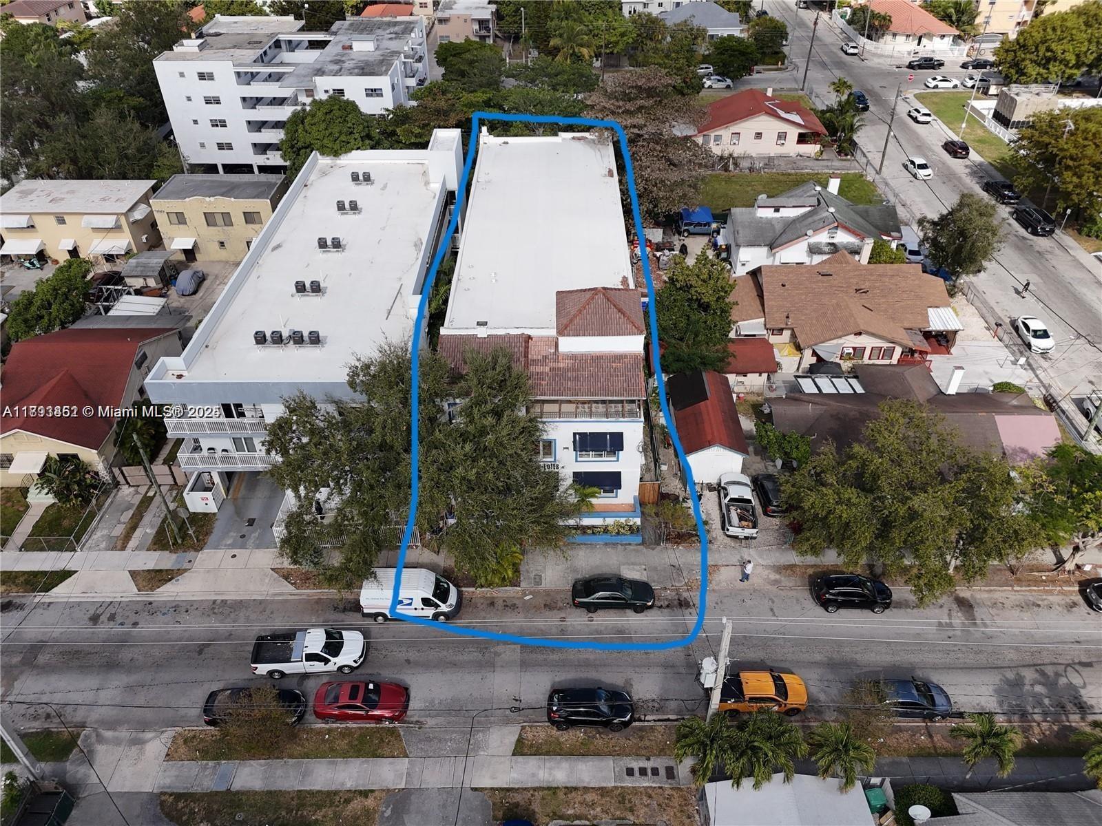 1021 Northwest 3rd Street, Unit 305 Miami, FL 33128 - Photo 6 of 22 an aerial view of a house with a yard