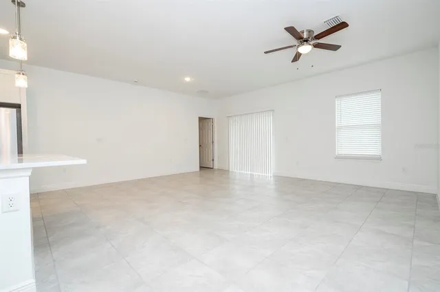a view of kitchen with white cabinets stainless steel appliances