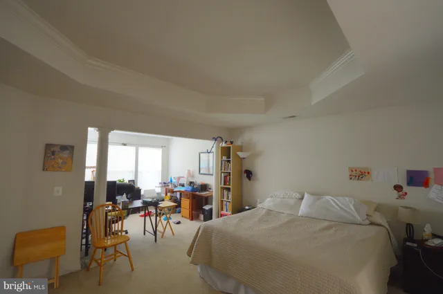 a bed room with a bed and a chair