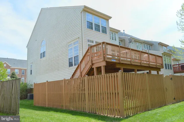 a view of a big building with big yard and large trees