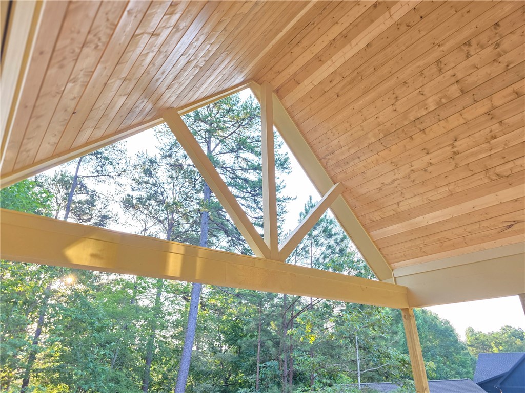 107 Abaco Lane Seneca, SC 29672 - Photo 11 of 28 An inviting covered patio with a vaulted tongue and groove ceiling.