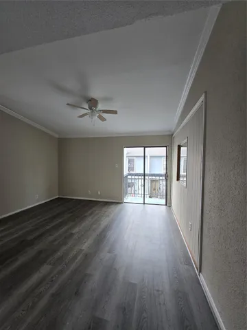 a large kitchen with stainless steel appliances granite countertop a stove and a refrigerator