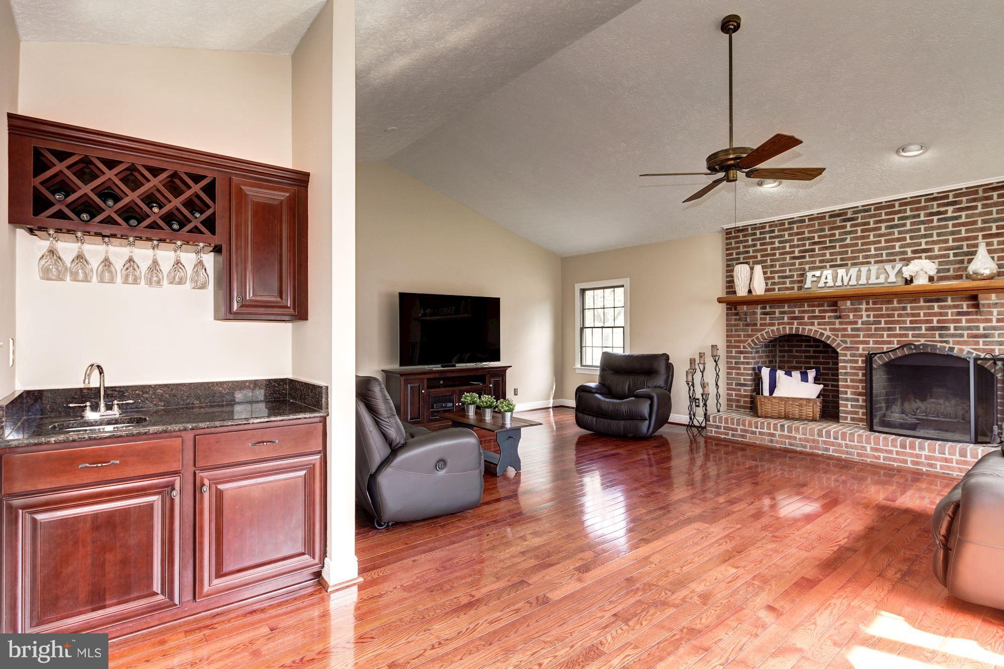 3315 Whitesworth Road Phoenix, MD 21131 - Photo 16 of 30 Family Room w/Wet Bar/HWD/WB Fireplace