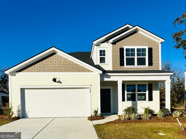 a front view of a house with yard