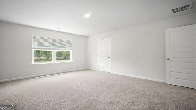 an empty room with windows