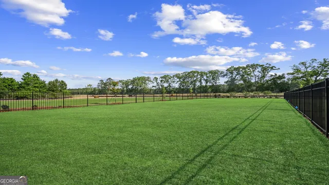 a view of a golf course with a lake