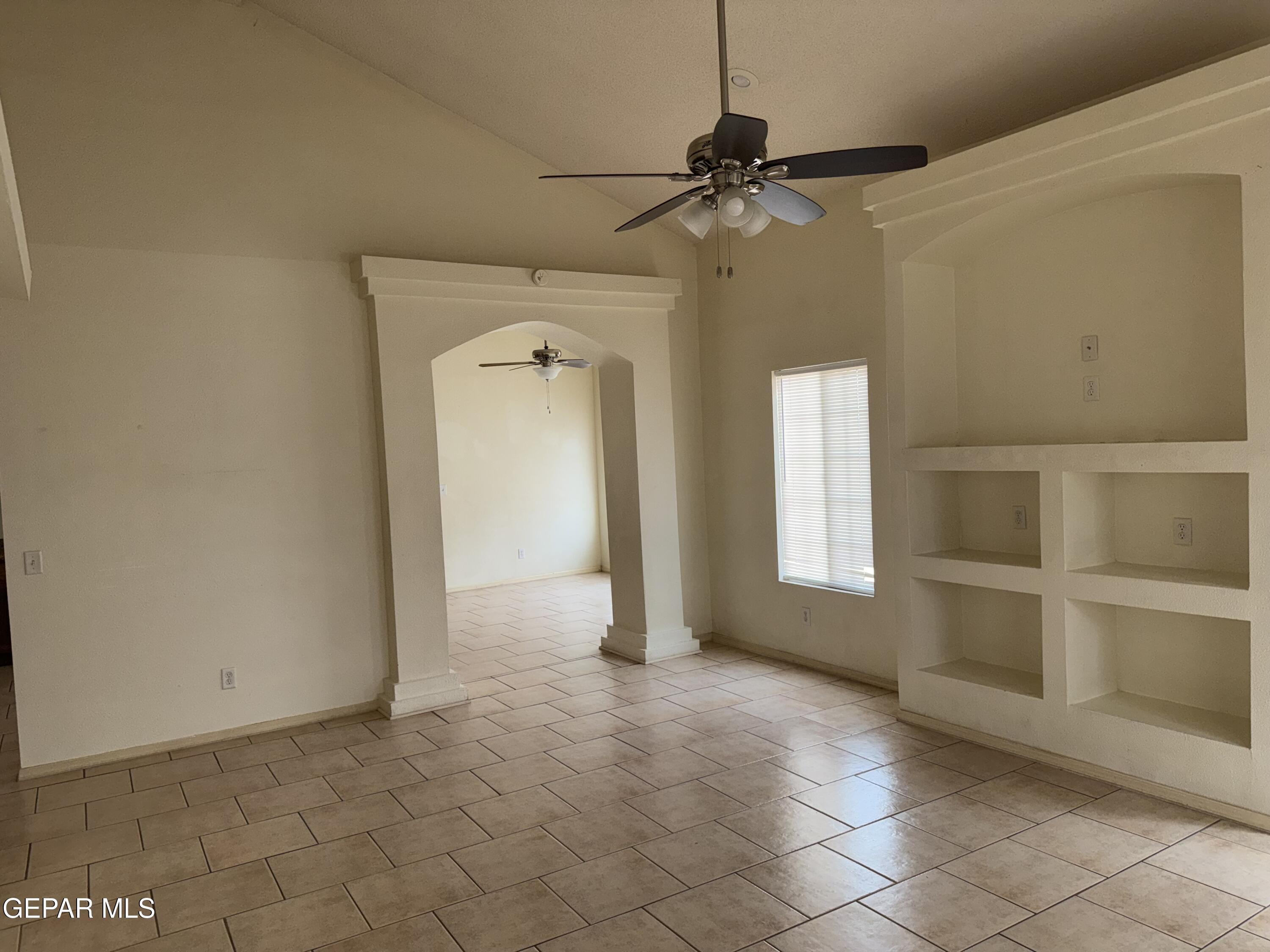 456 Passmore Road Socorro, TX 79927 - Photo 4 of 23 a view of an empty room with a window