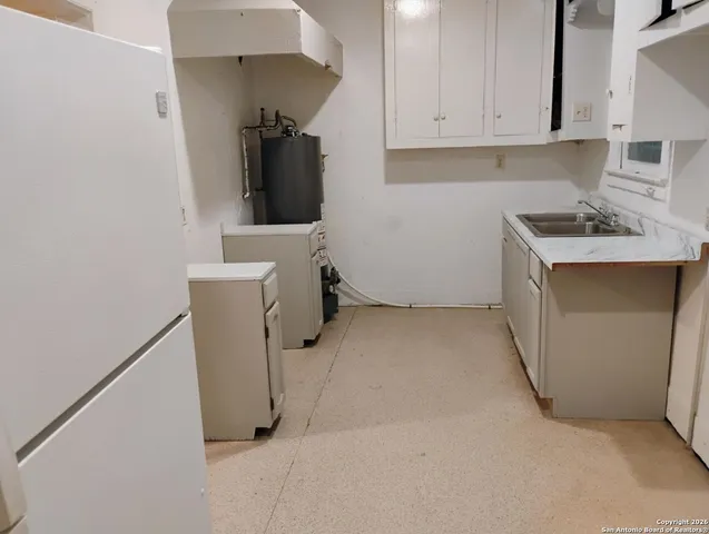 a view of storage and utility room with washer and dryer