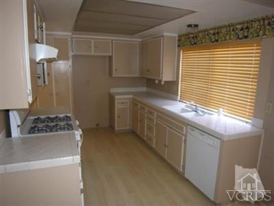 284 Mariposa Drive Camarillo, CA 93012 - Photo 5 of 16 a kitchen with a sink and a refrigerator