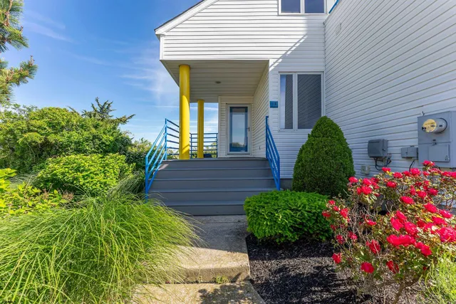 a spacious bedroom with a large bed and a large window