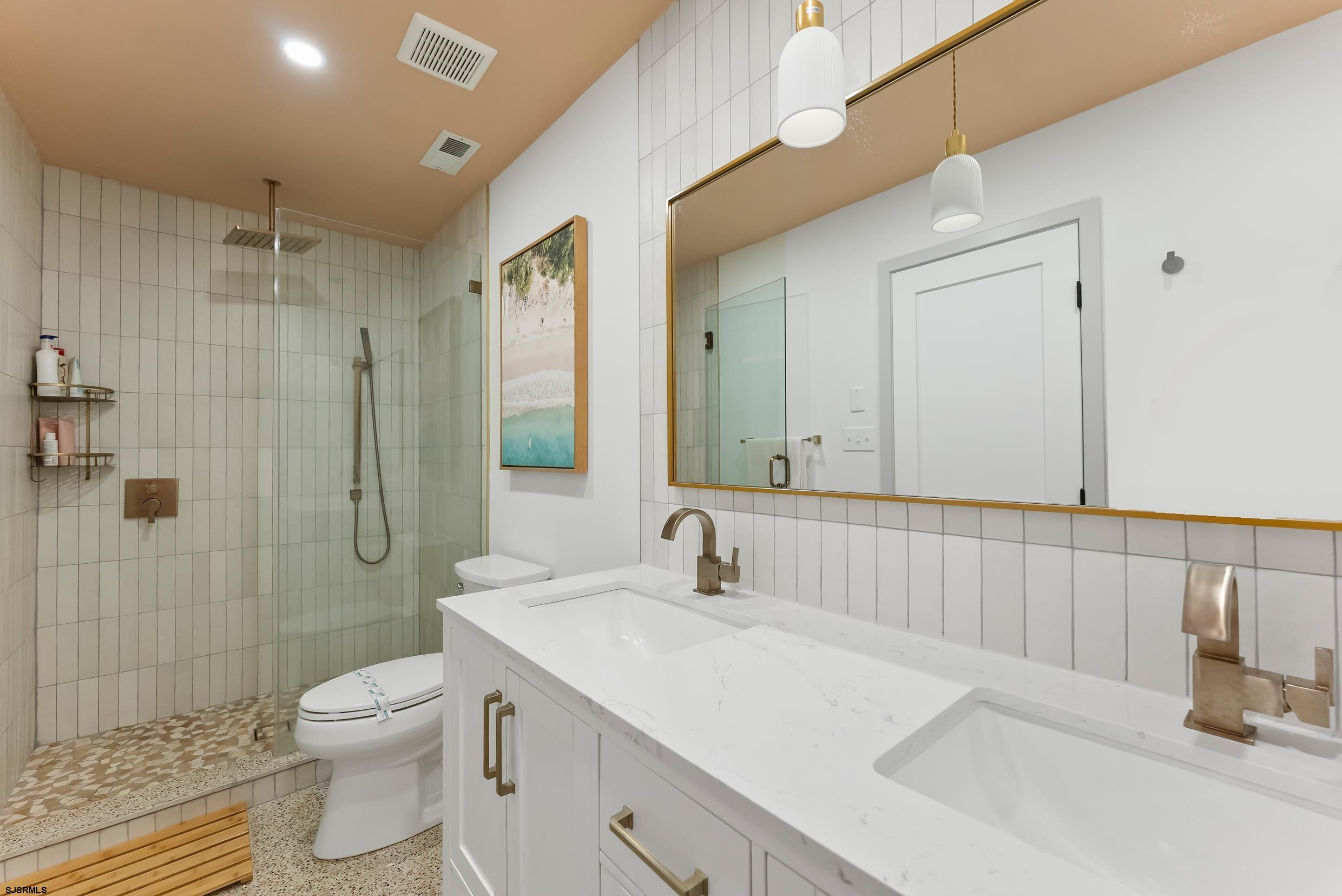 13 Delmar Drive, Unit 13 Brigantine, NJ 08203 - Photo 17 of 98 a bathroom with a sink toilet and shower