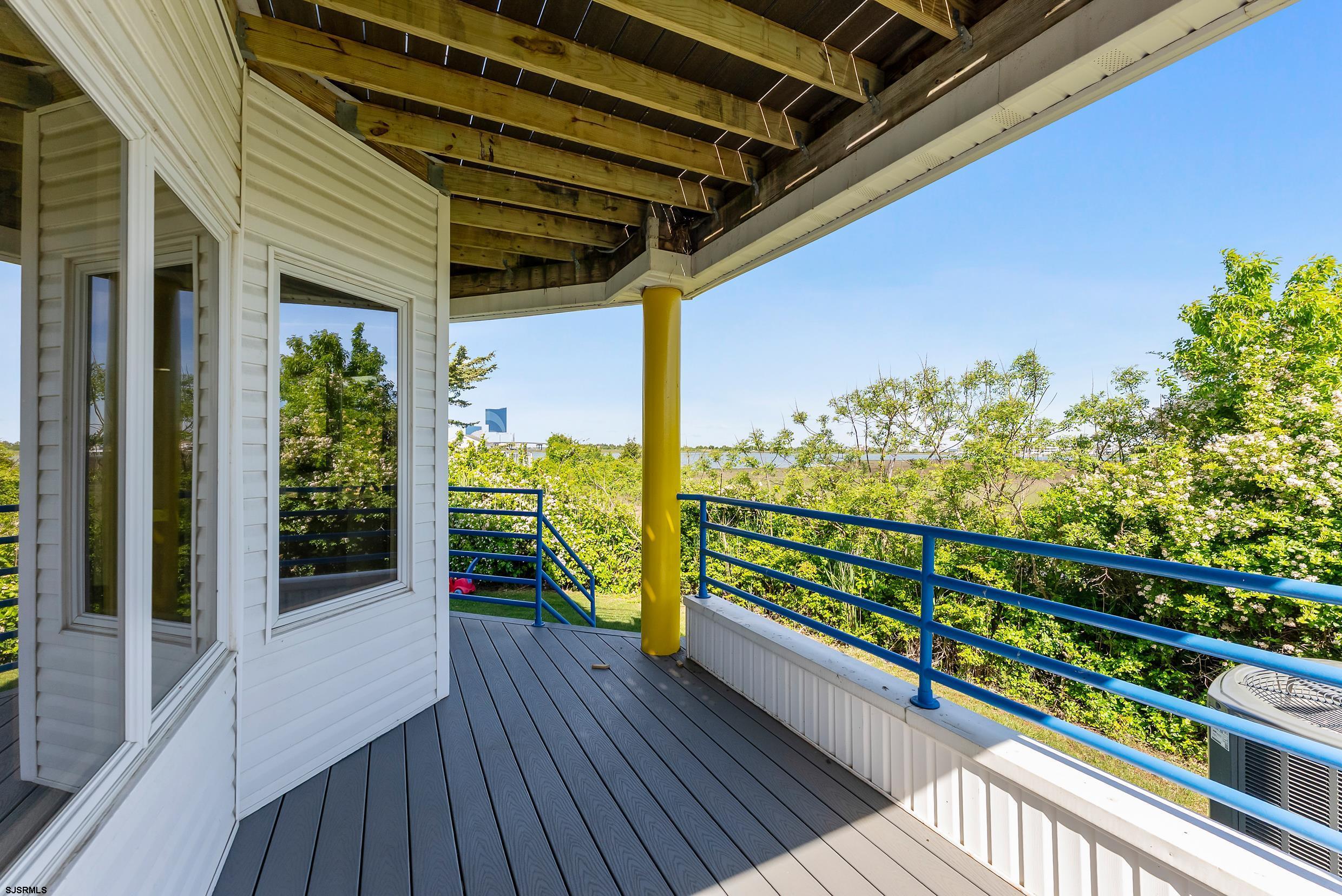 13 Delmar Drive, Unit 13 Brigantine, NJ 08203 - Photo 20 of 98 a view of a balcony with wooden floor